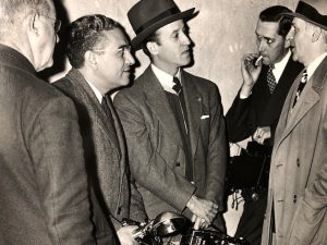 columnist Walter Winchell, circa 1938. Printed by Dick Ware from a negative supplied by Joe Costa. Costa is second from left. Photo courtesy of Ball State University.